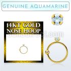 ghge8 14kt gold nose hoop w a 2mm prong set aquamarine stone