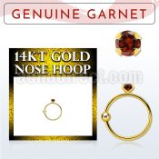 ghge2 14kt gold nose hoop w a 2mm prong set garnet stone